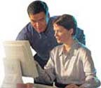 Hosting Options: Man and woman looking at computer monitor