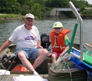 Lauren and Grandpa in the boat